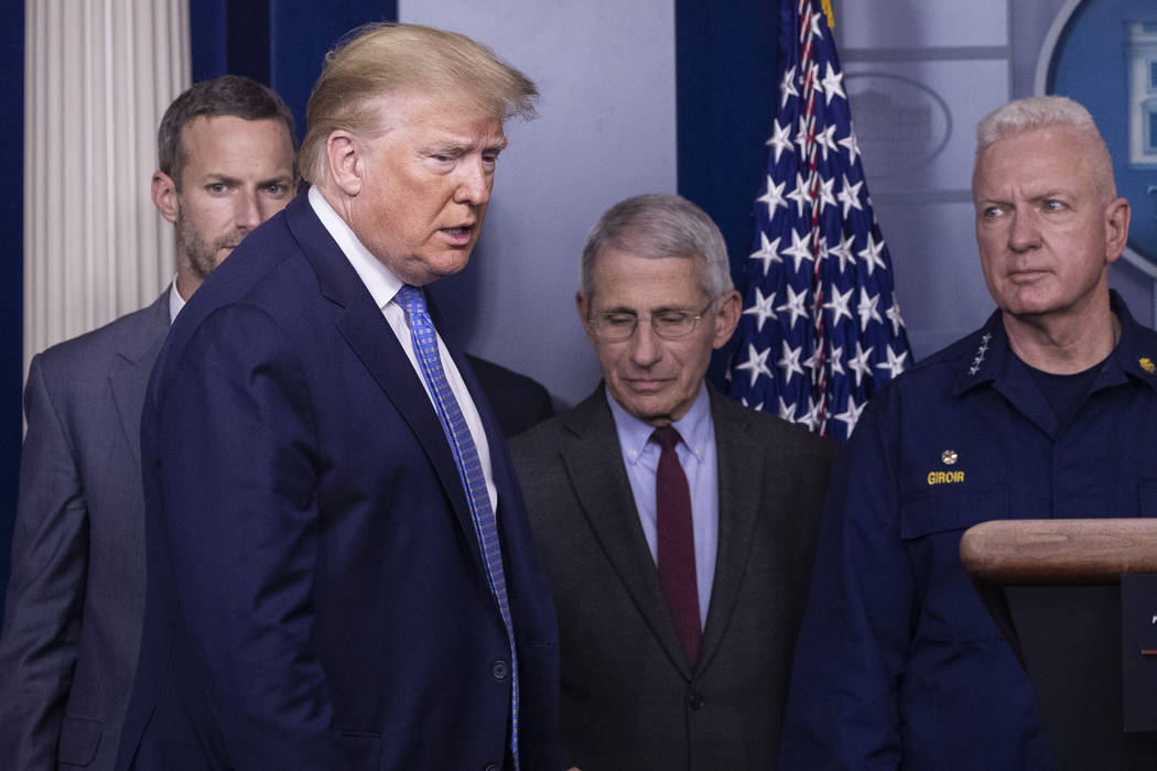President Donald Trump arrives to speak, with Dr. Anthony Fauci, director of the National Insti ...