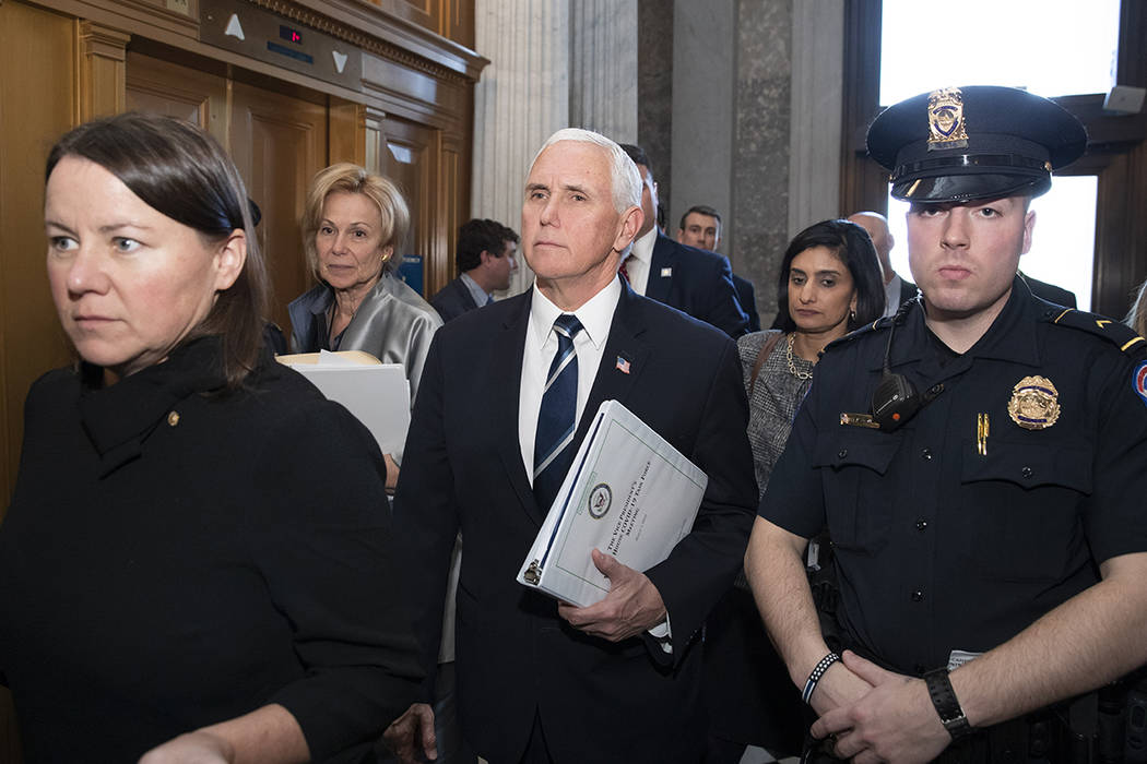 Vice President Mike Pence, center, who is the head of President Donald Trump's coronavirus task ...