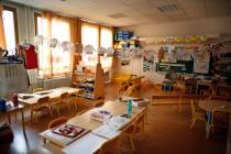 An empty classroom is seen at a closed school in Paris, Monday, March 16, 2020. France plans to ...
