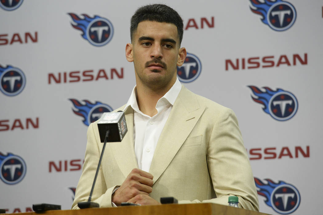 Tennessee Titans quarterback Marcus Mariota answers questions after an NFL football game agains ...
