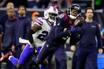 Houston Texans wide receiver DeAndre Hopkins (10) catches a pass for a first down as Buffalo Bi ...