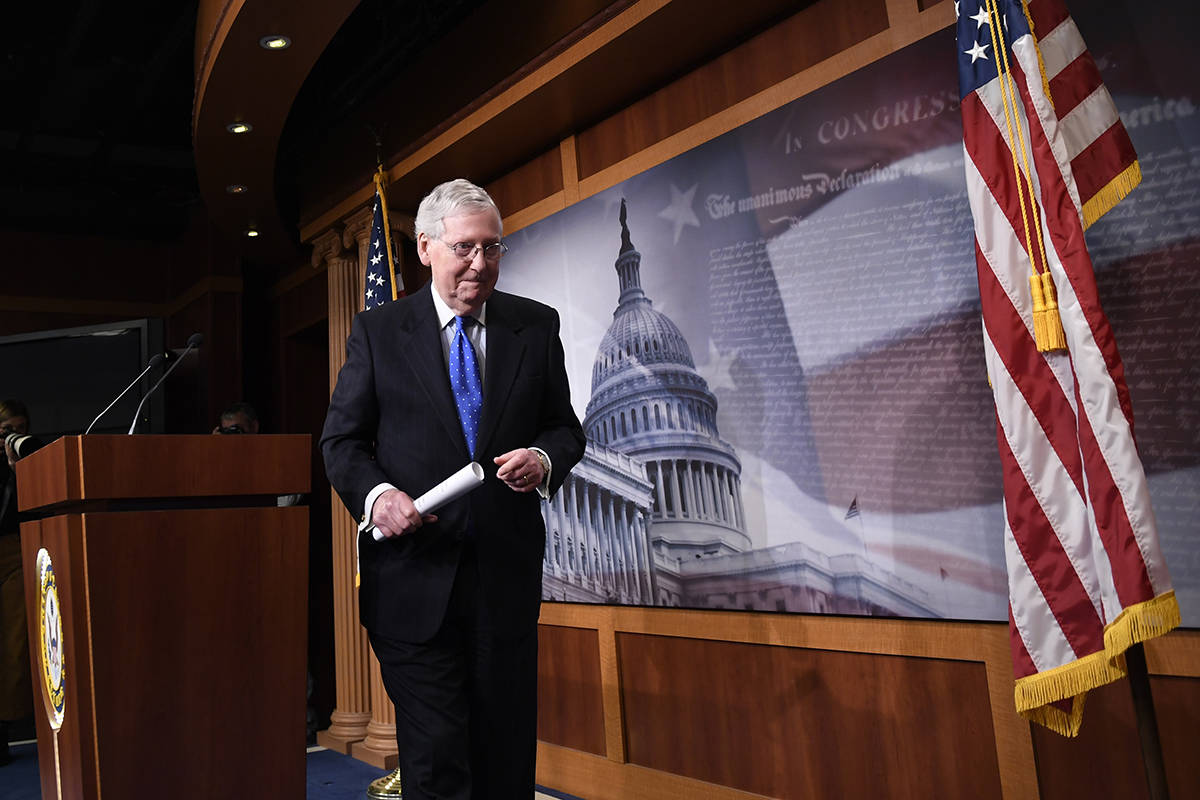 Senate Majority Leader Mitch McConnell of Ky., walks off of the stage following a news conferen ...