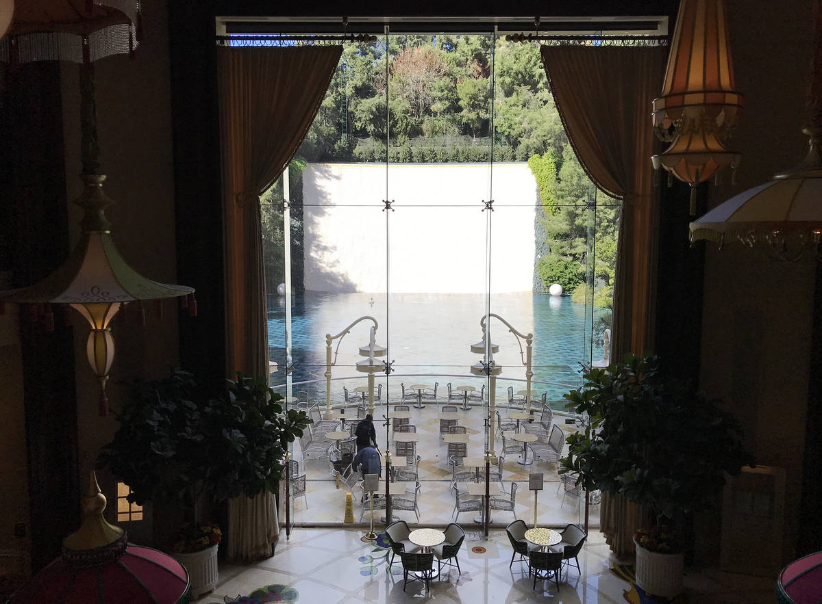 The pool at the Wynn is empty but for employees on Tuesday, March 17, 2020, in Las Vegas. (Elle ...