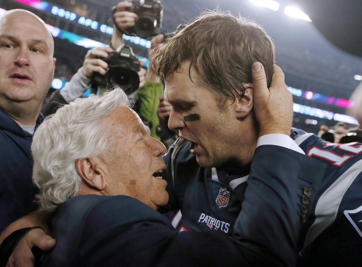 FILE - In this Jan. 21, 2018, file photo, New England Patriots owner Robert Kraft, left, embrac ...