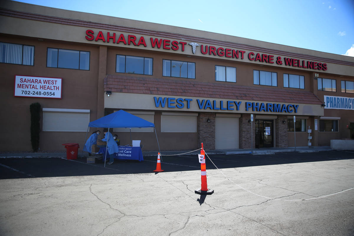 Lab technicians and phlebotomists assist people at the Sahara Urgent Care & Wellness center in ...