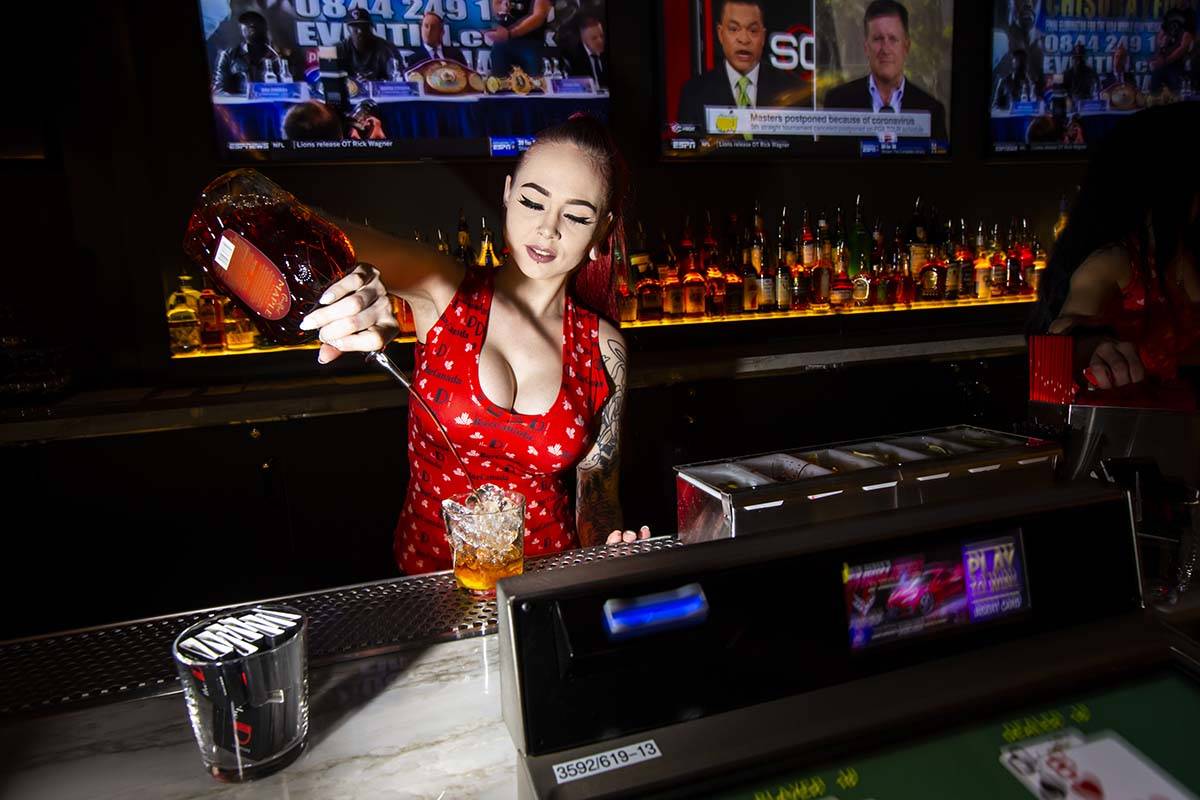 Bartender Hunter Cox prepares "The Old Canadian Way" at BarCanada at the D Las Vegas ...