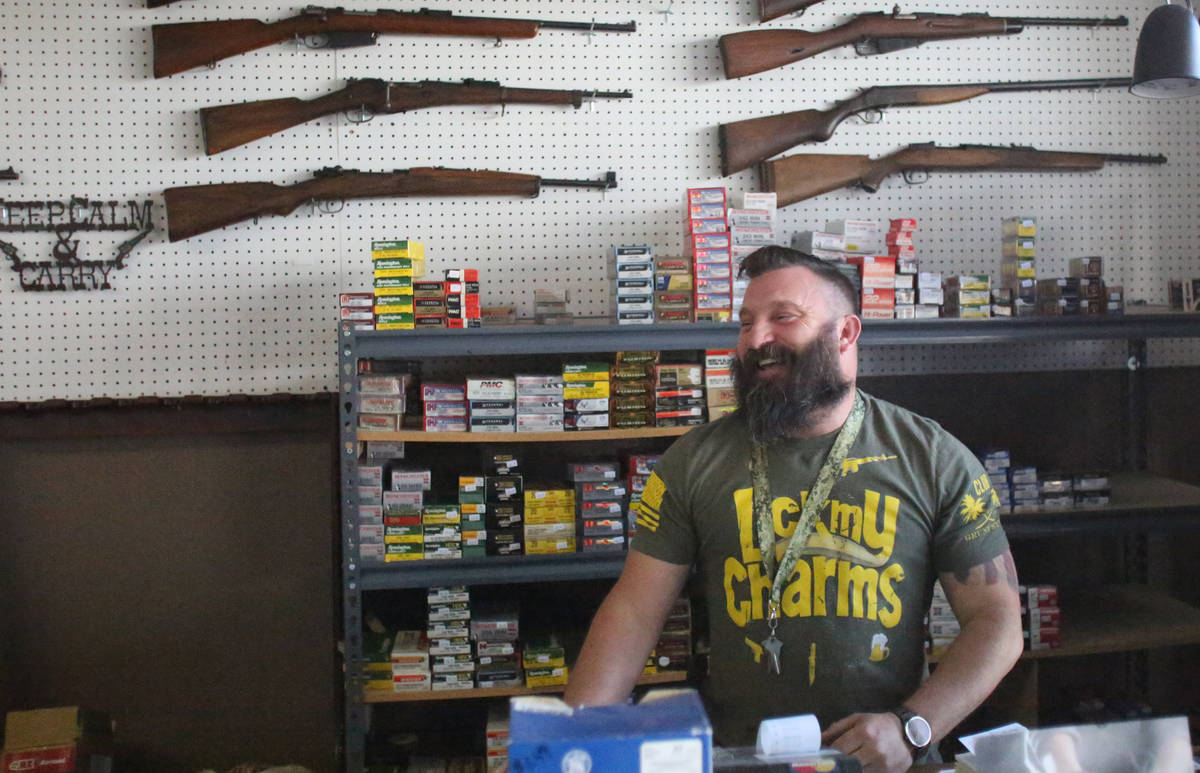 Joseph Potter of Elite Firearms on Sahara Avenue says sales of guns and ammo have been high at ...