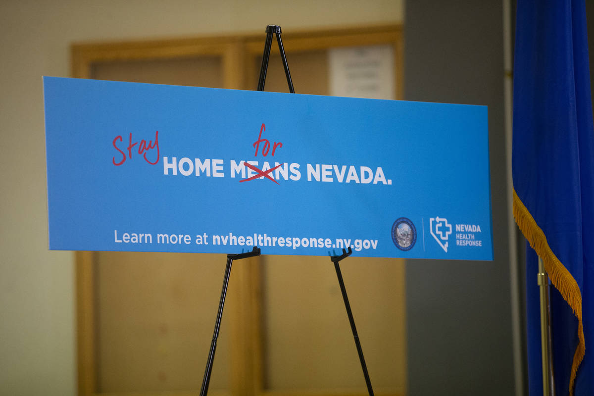 Signage urges Nevada residents to stay home during Gov. Steve Sisolak's press conference to ann ...