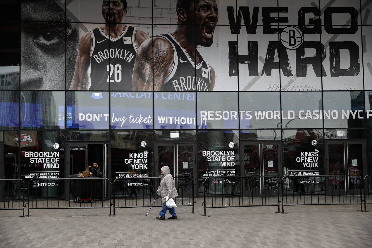 A pedestrian passes an entrance to the Barclays Center in the Brooklyn borough of New York on T ...