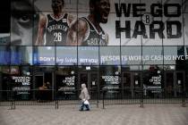 A pedestrian passes an entrance to the Barclays Center in the Brooklyn borough of New York on T ...