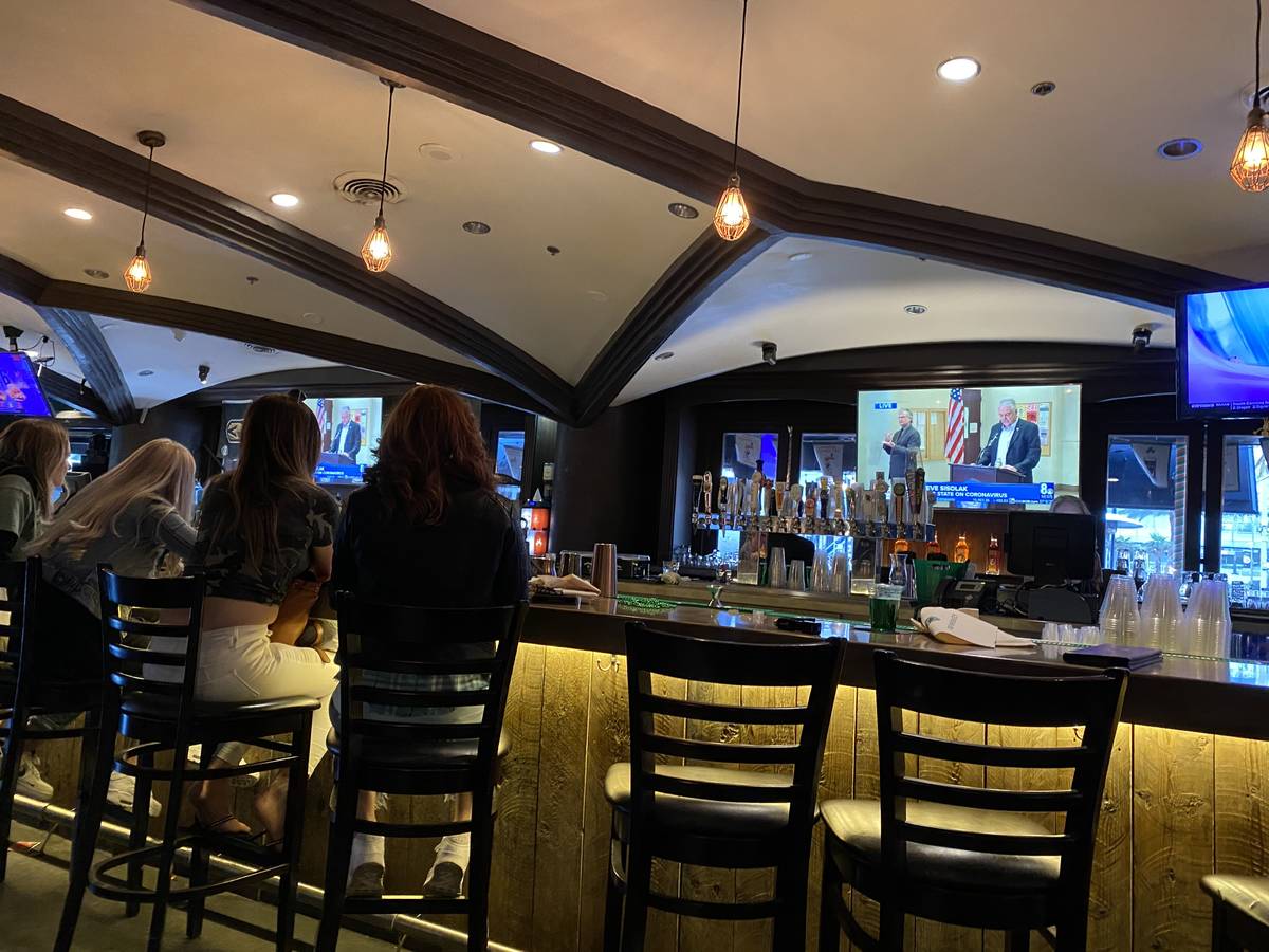 Shannon White (right) and here three daughters watch as Gov. Steve Sisolak announces the Las Ve ...