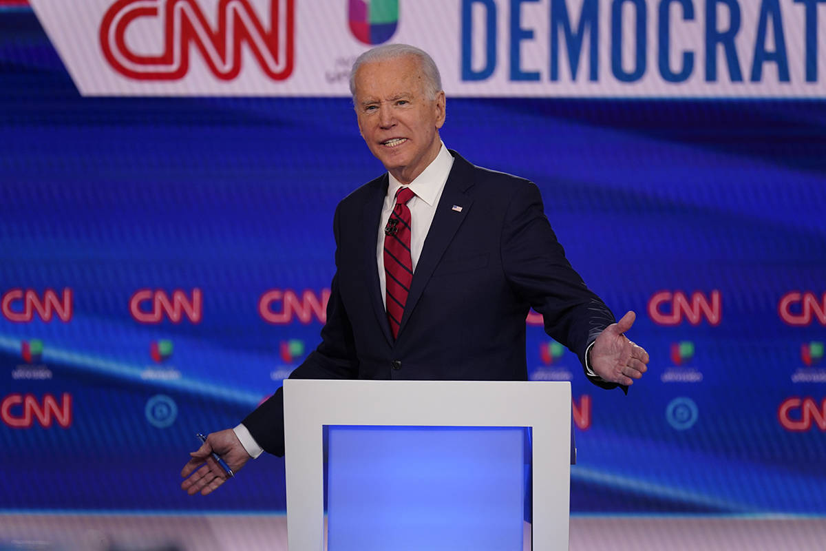 Sen. Bernie Sanders, I-Vt., and former Vice President Joe Biden, participate in a Democratic pr ...