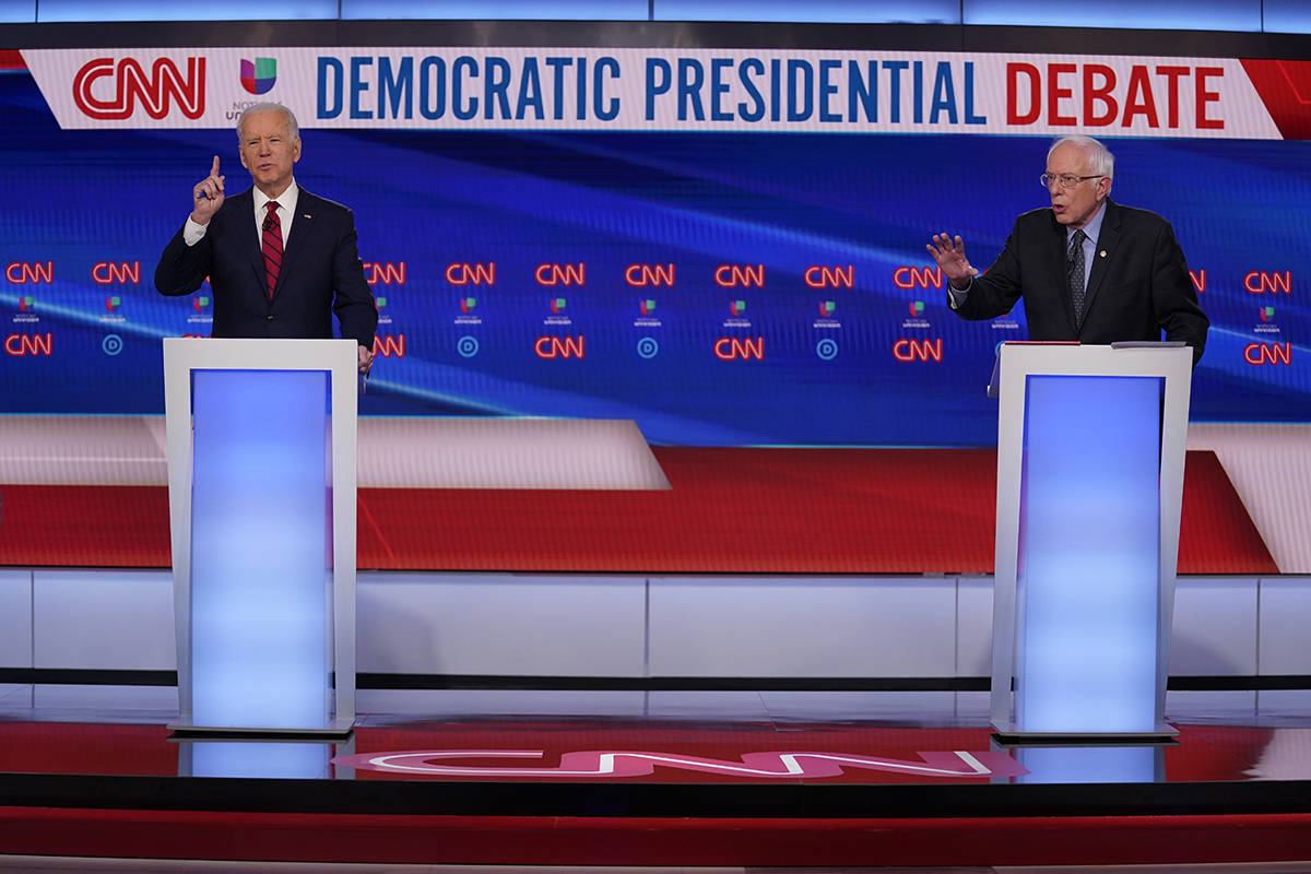 Sen. Bernie Sanders, I-Vt., and former Vice President Joe Biden, participate in a Democratic pr ...