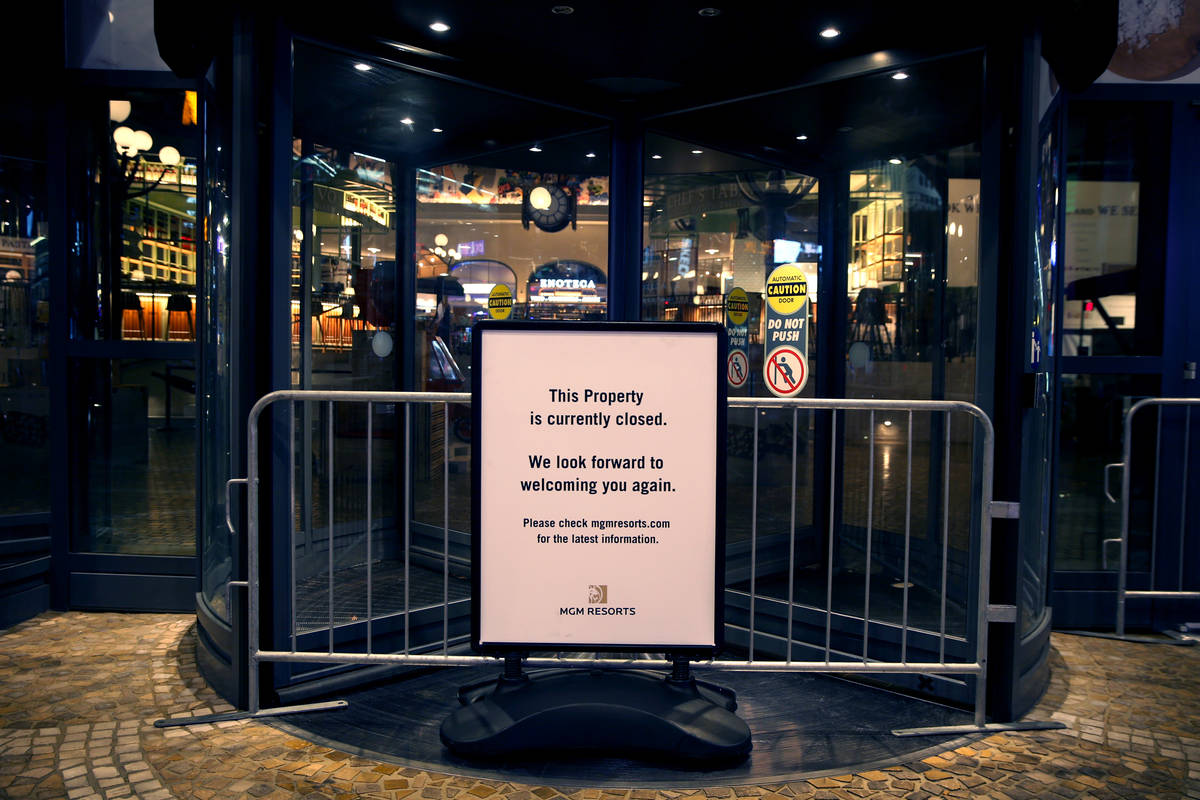 A sign notifies the public that Eataly is temporarily closed as non-essential business closures ...