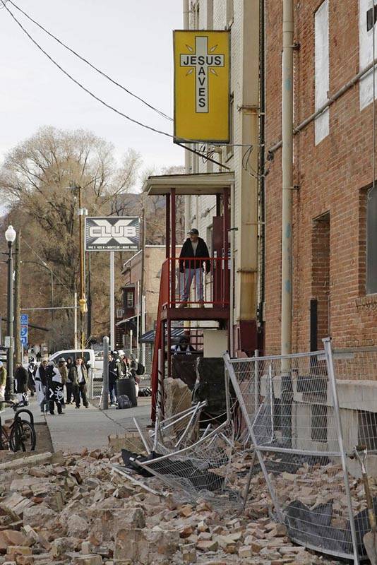 A man looks at the rubble after an earthquake Wednesday, March 18, 2020, in Salt Lake City. A ...
