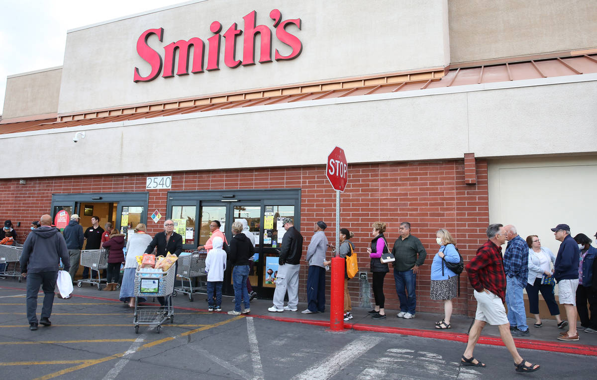 Seniors line up outside a Smith's store on Maryland Parkway on Wednesday, March 18, 2020, in La ...