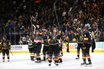 Golden Knights players celebrate their 4-1 victory over the San Jose Sharks in an NHL season-op ...