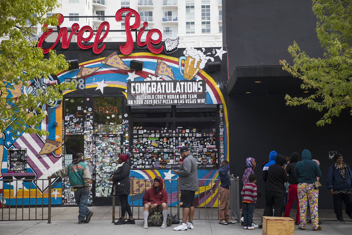 A line stretching to the end of the block for Evel PieÕs free pizza giveaway in Las Vegas, ...