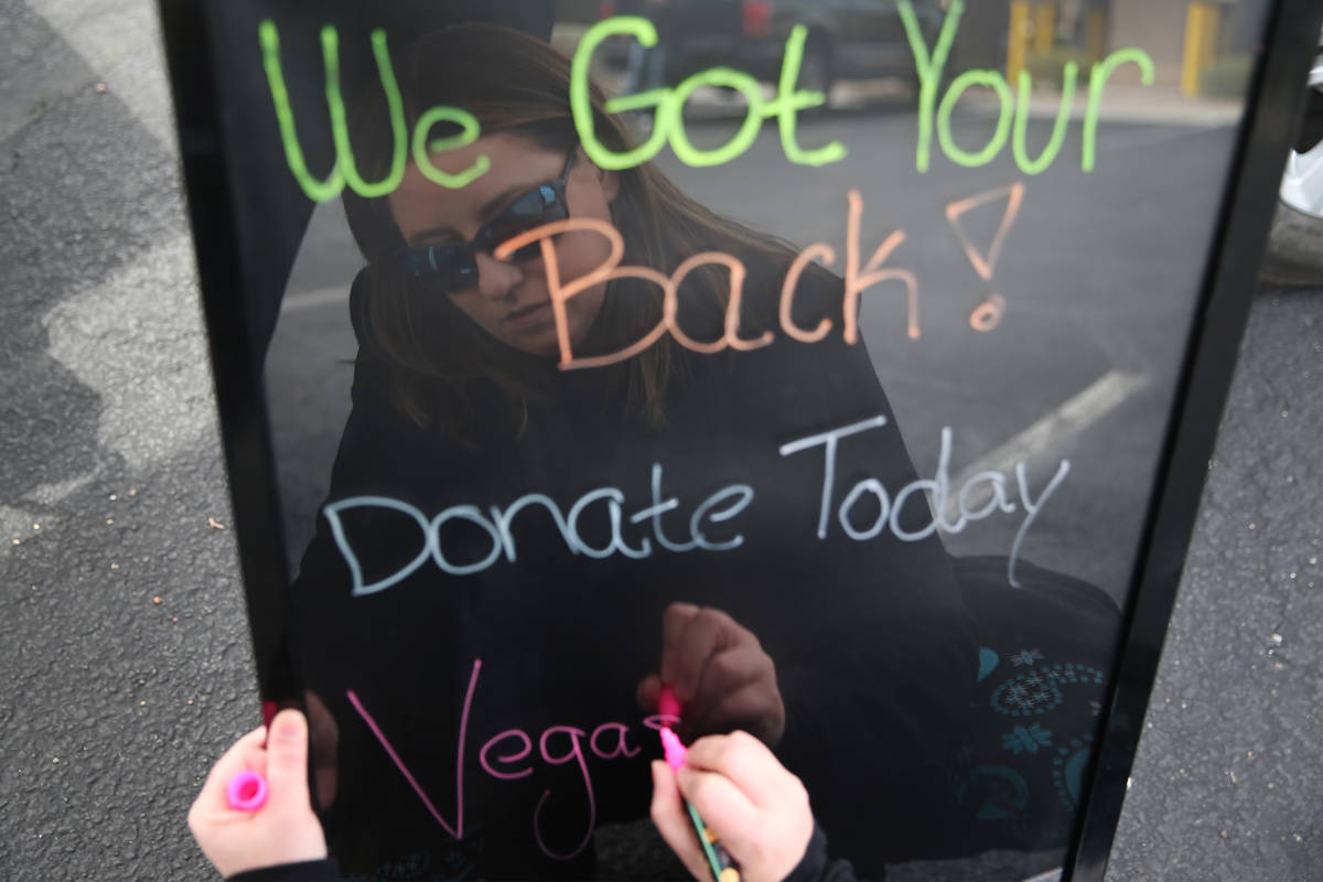 Danielle Doyle, who was collecting paper goods, cleaning supplies and food for seniors in the S ...