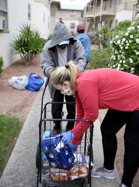 Ashley Degaetano of Dr. Nick Liu Orthopedic Surgery delivers food to Checlzzli Powell Jr., 76, ...