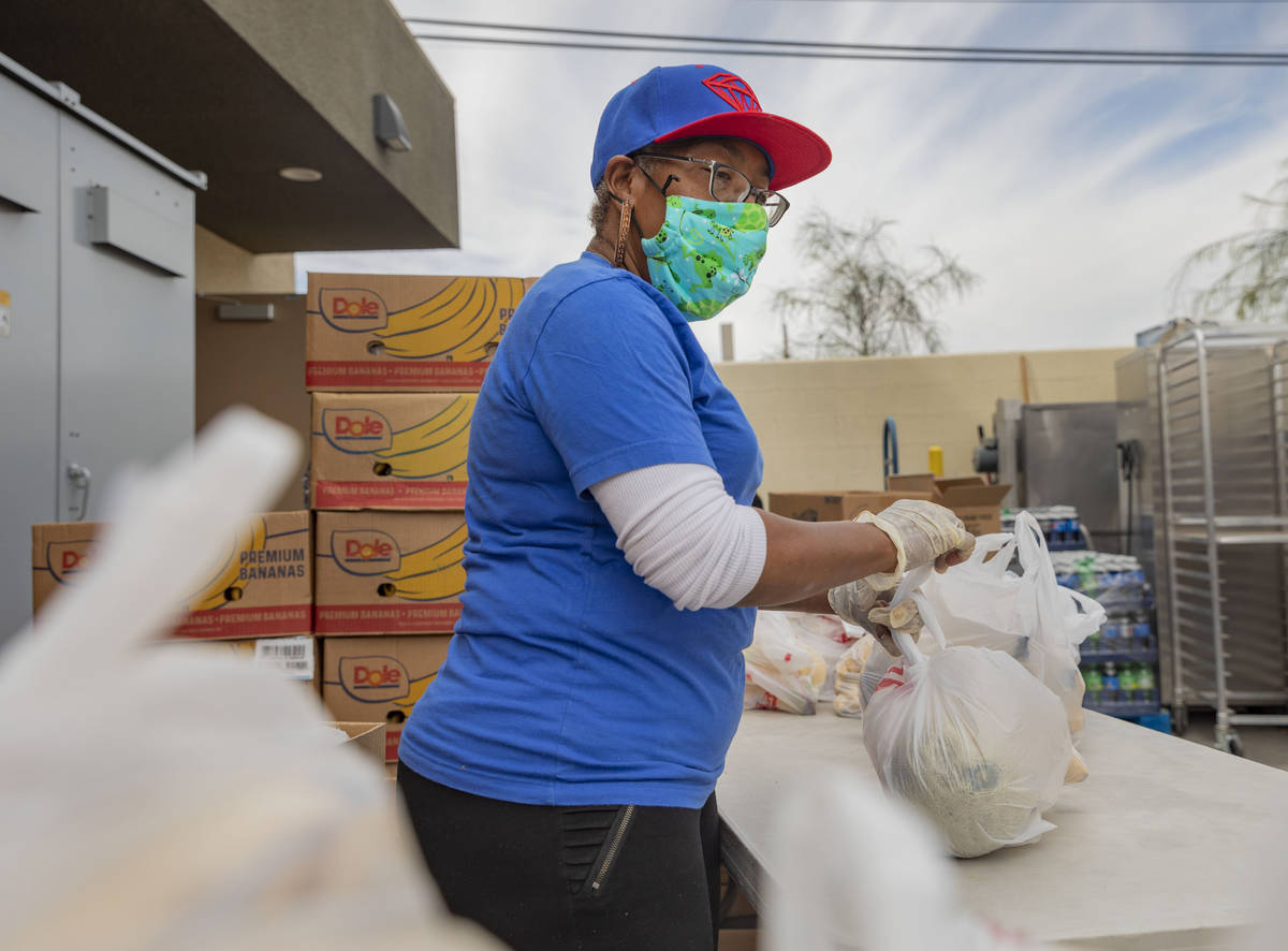 Family care manager for Lutheran Social Services of Nevada Trnee Stephenson bags fruit for emer ...