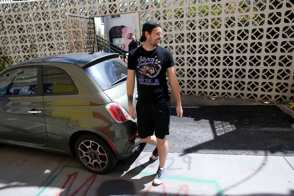 Laid off Carson Kitchen server Kakota McKinnon greets co-workers at a safe distance after recei ...