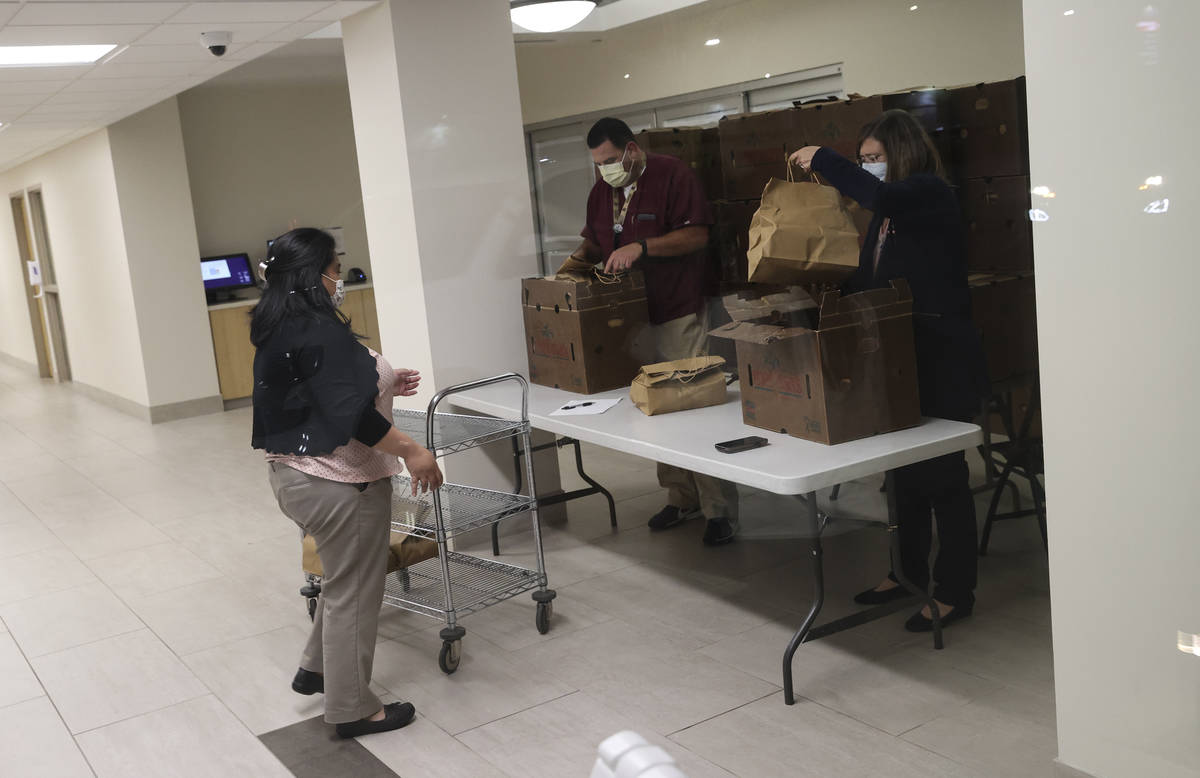 Hospital workers organize meals from Piero's Italian Cuisine that were delivered to S ...