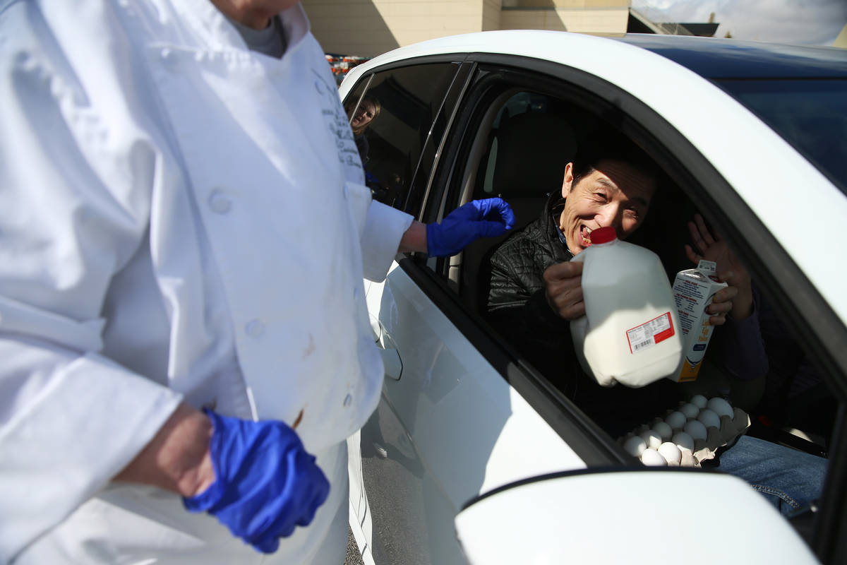 A team member receives free food at the M Resort hotel-casino in Henderson, Friday, March 20, 2 ...