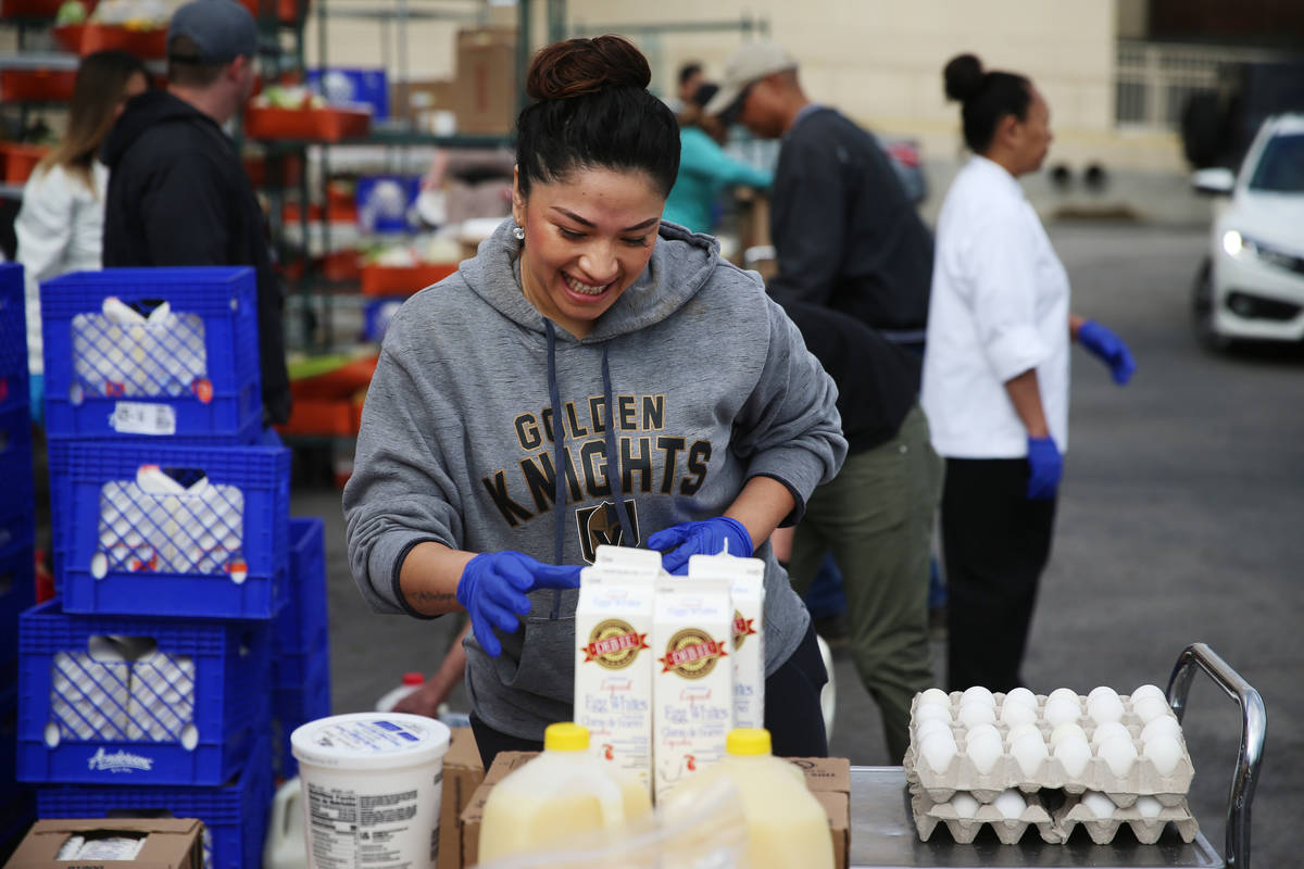 Assistant manager Jenny Leiva organizes food to be picked up by team members at the M Resort h ...