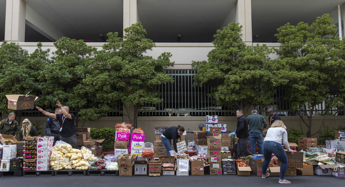 Food donated by MGM is up for grabs outside the Las Vegas Metropolitan Police Department headqu ...