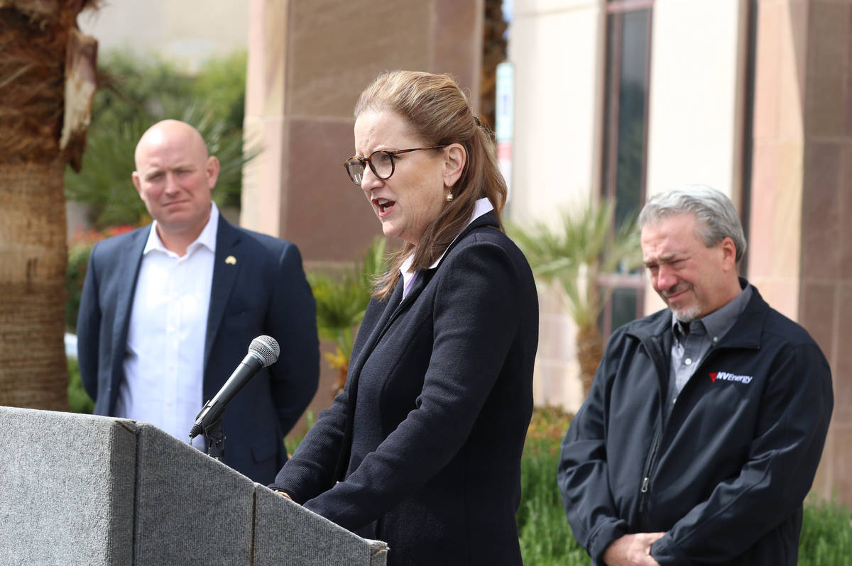 United Way Southern Nevada President and CEO Kyle Rahn, center, speaks as Brian Formisano, left ...