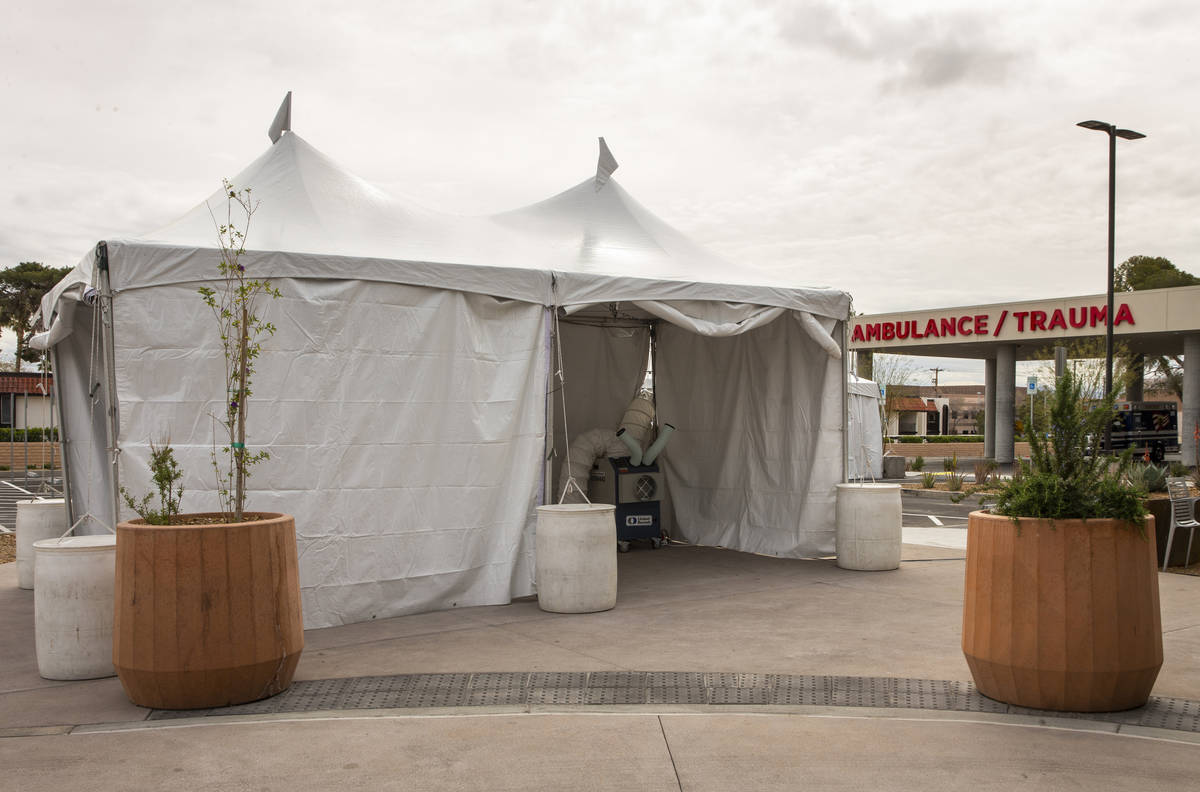 Sunrise Hospital and Medical Center has erected tents, currently empty, in their parking lot ne ...
