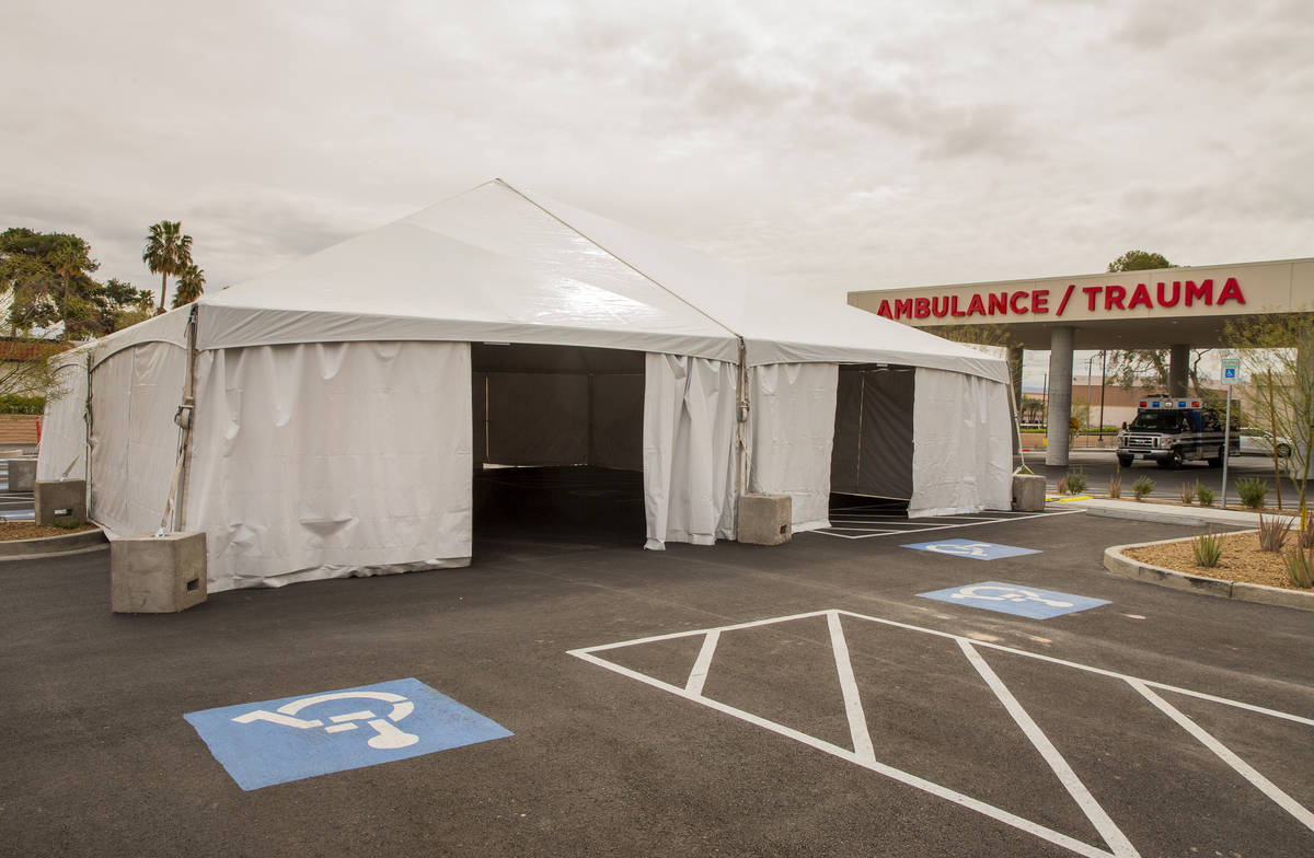 Sunrise Hospital has erected tents, currently empty, in their parking lot near emergency/trauma ...