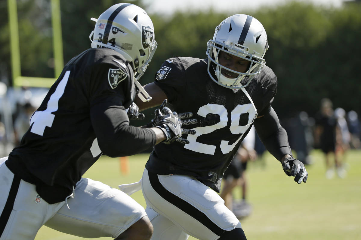 Oakland Raiders free safety Lamarcus Joyner (29) and running back Mack Brown, left, during NFL ...