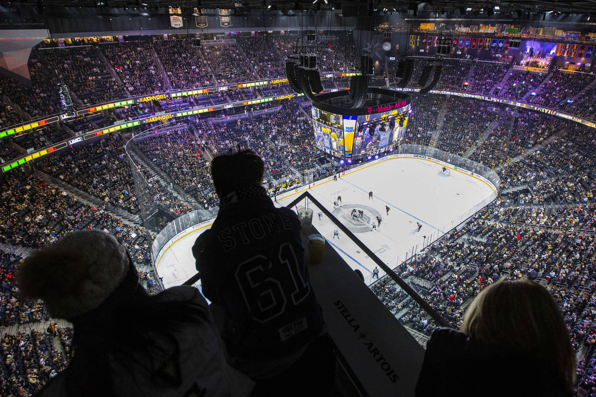 Golden Knights fans watch the puck drop from the Hyde Lounge space at T-Mobile Arena at the sta ...