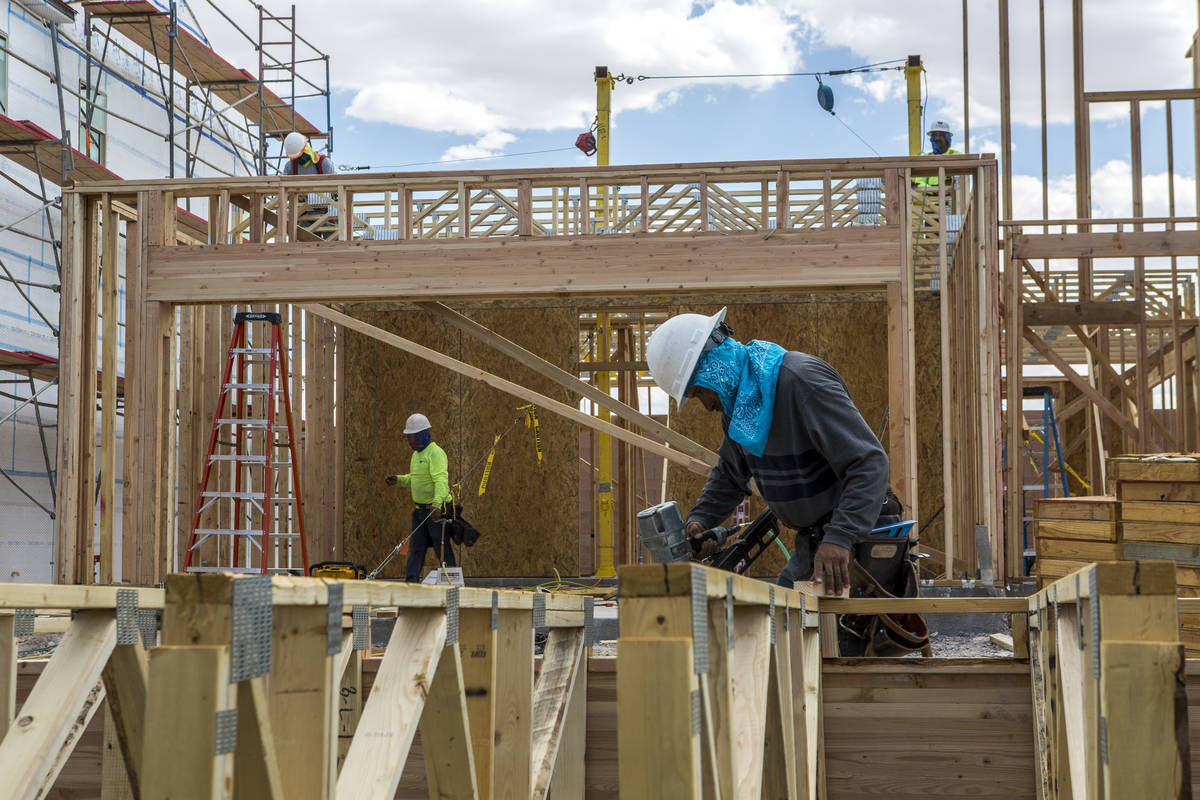 Workers build a Century Communities home in southwest Las Vegas in 2017. The homebuilding indus ...
