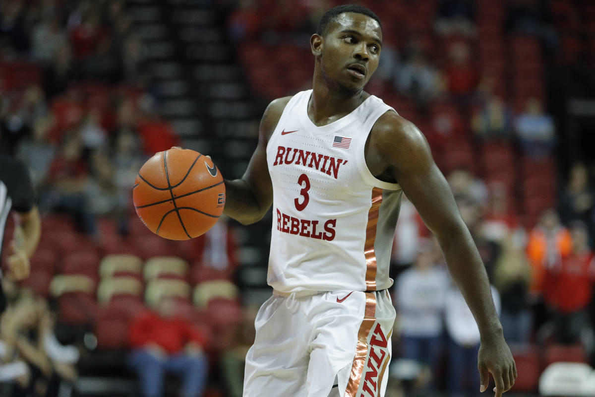 UNLV's Amauri Hardy (3) plays against Utah State during an NCAA college basketball game Wednesd ...