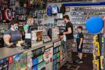 Customers purchase items at the GameStop store at 947 South Rainbow Boulevard in Las Vegas whil ...