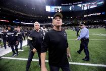New Orleans Saints head coach Sean Payton looks up as he walks off the field after overtime of ...