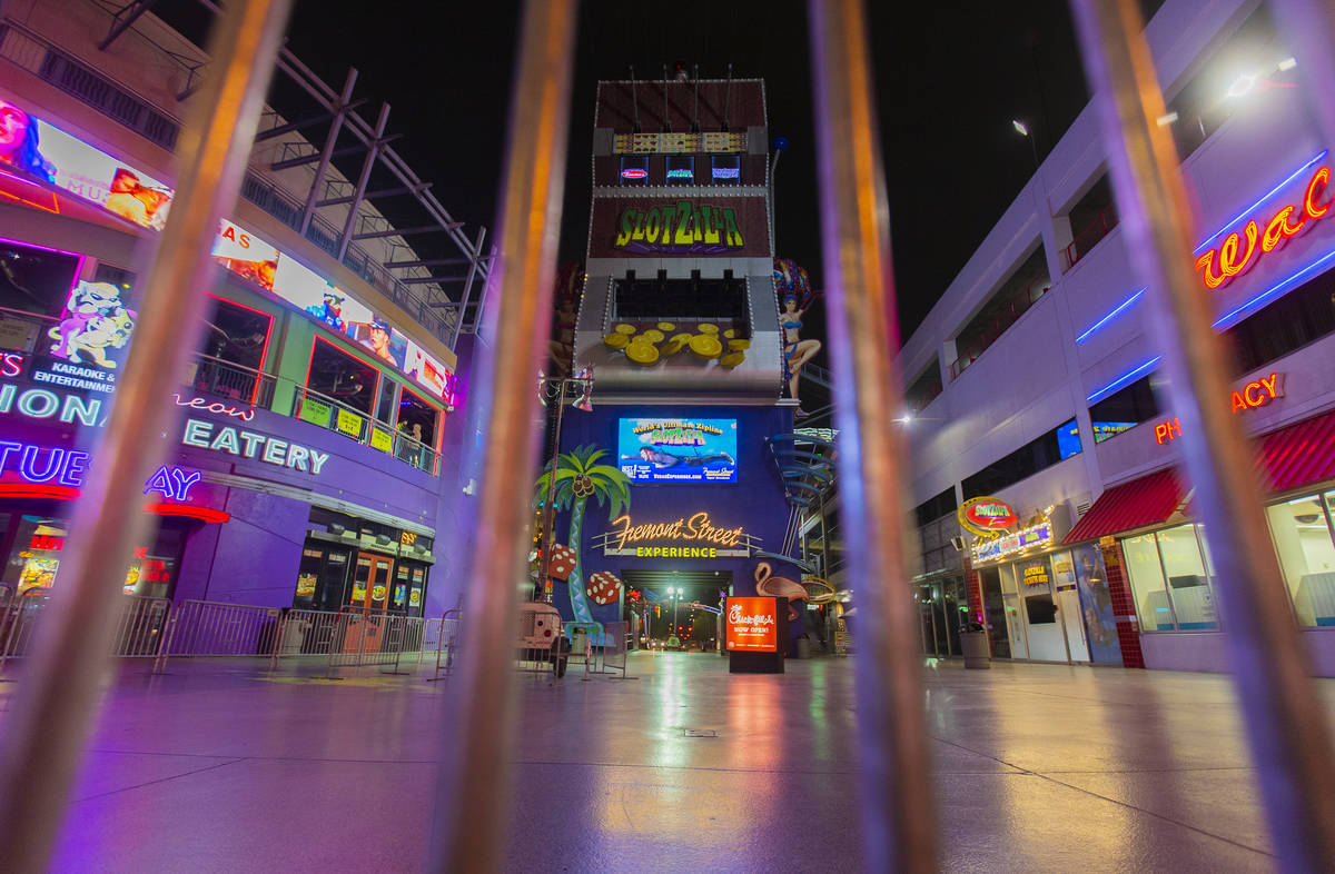 Gates block the entrance to the Fremont Street Experience in downtown Las Vegas, which is close ...