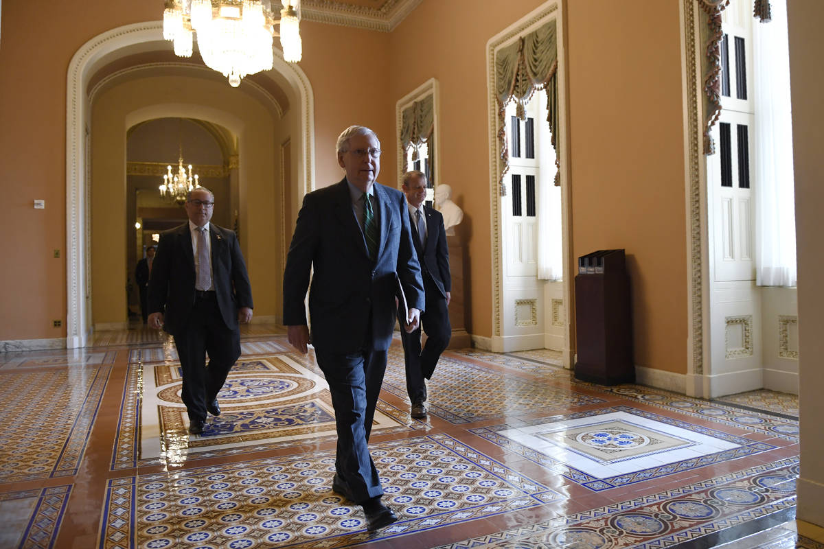 Senate Majority Leader Mitch McConnell of Ky., walks to the Senate floor on Capitol Hill in Was ...