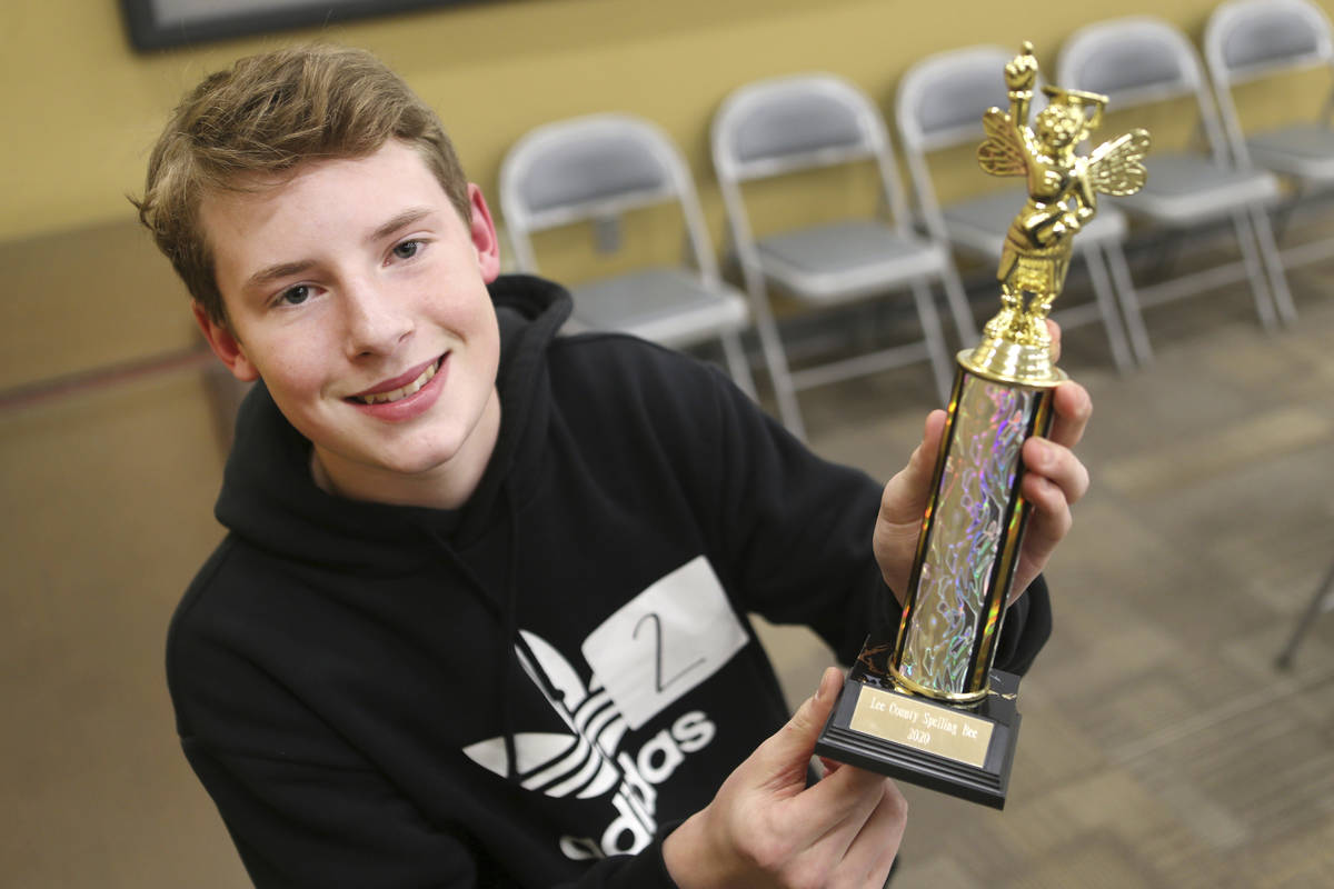 Sam Baxter, an eighth grader at Guntown Middle School, holds a trophy after winning the Lee Cou ...
