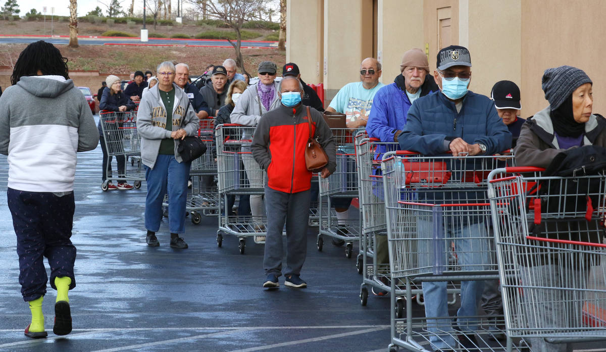 Seniors line up outside Costco on Friday, March 20, 2020, in Henderson. The store reserved earl ...