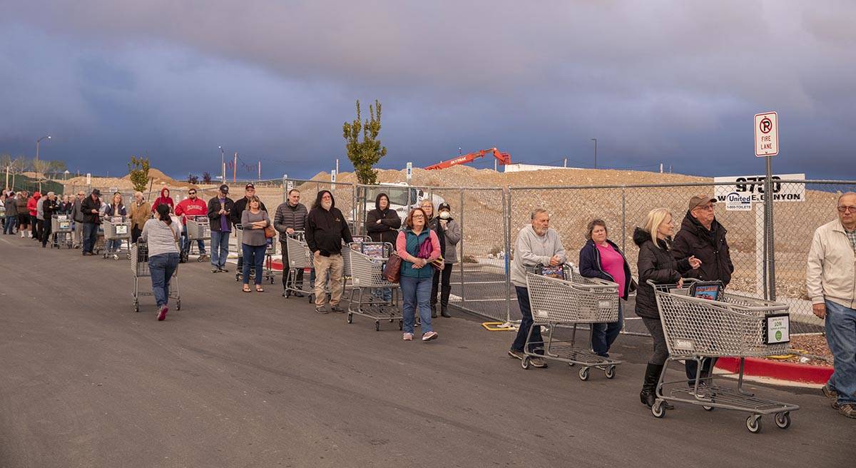 Seniors line up outside of a Smith's Marketplace located at 9710 West Skye Canyon Park Drive in ...