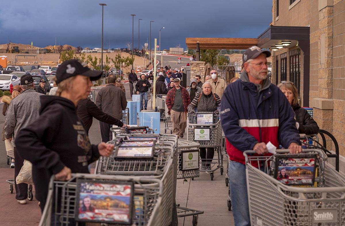 Seniors line up at the Smith's Marketplace located at 9710 West Skye Canyon Park Drive in Las ...