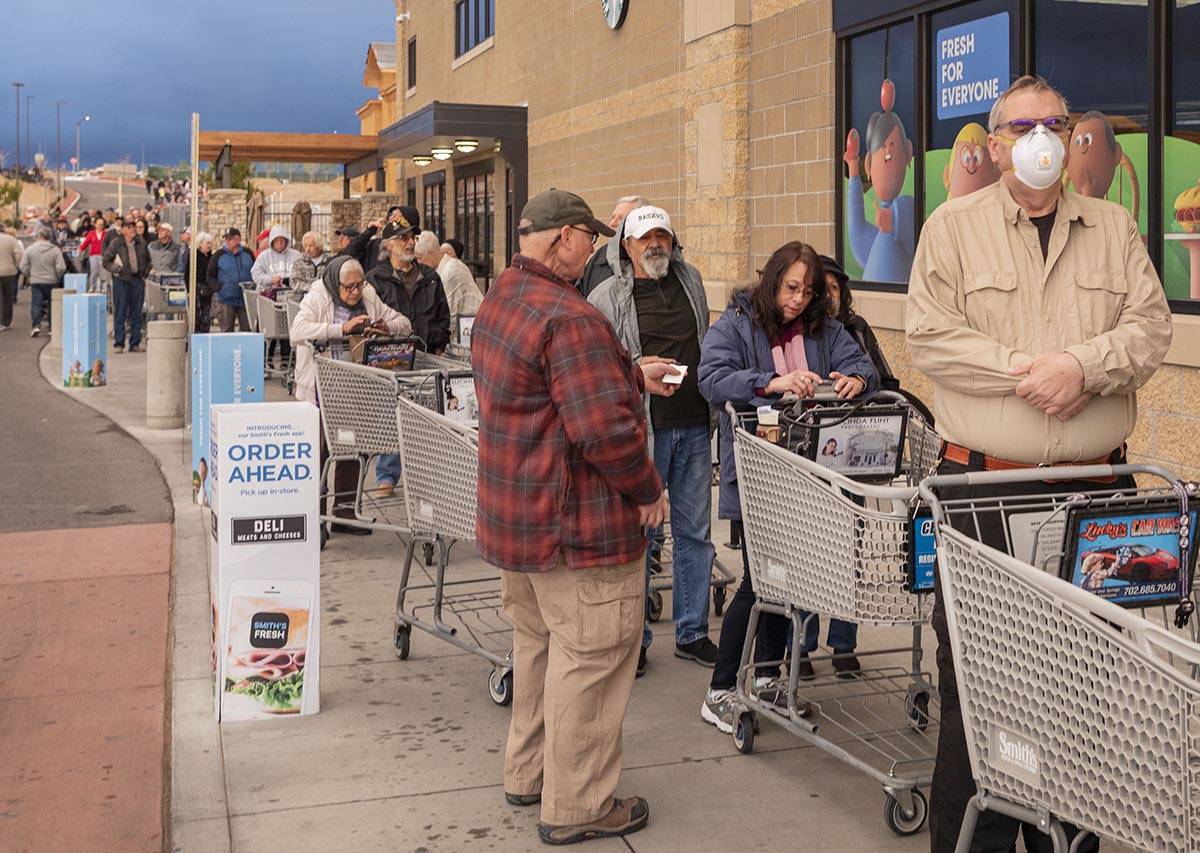 Seniors line up outside of a Smith's Marketplace located at 9710 West Skye Canyon Park Drive in ...