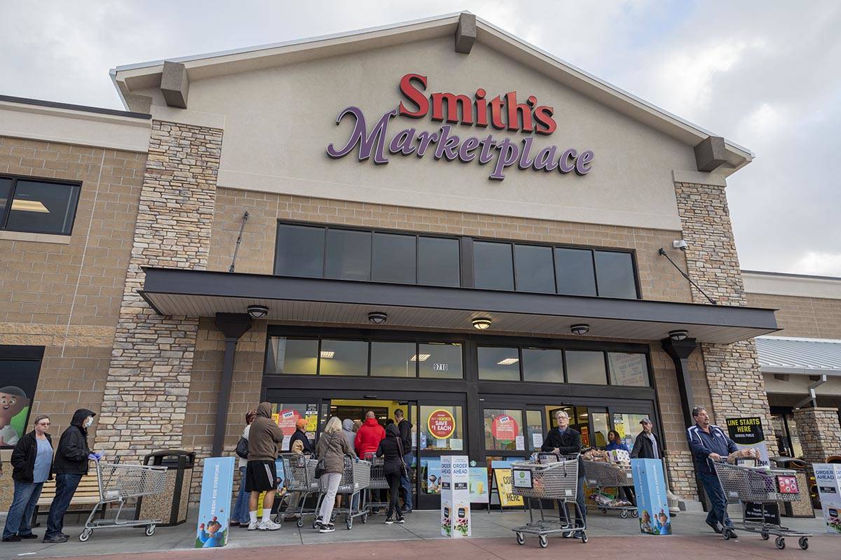 Seniors enter and exit a Smith's Marketplace located at 9710 West Skye Canyon Park Drive in Las ...
