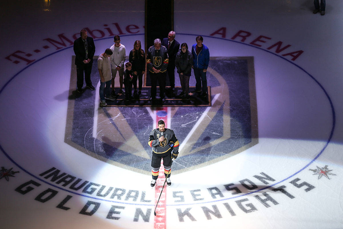 Vegas Golden Knights defenseman Deryk Engelland (5), center, speaks during a ceremony honoring ...