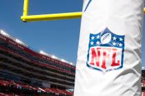 An NFL logo on a goal post pad. (AP Photo/Tony Avelar)
