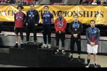 Michael Canada, third from the right, is seen on the podium following a wrestling match. (UNLV ...